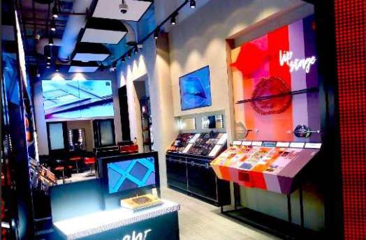 Beauty flagship store interior with branded displays and digital screens, built by Display Dynamics