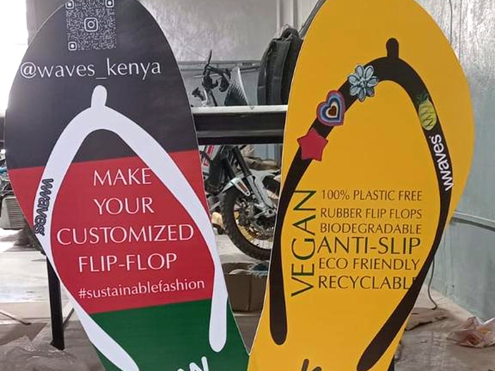 Two large flip-flop shaped printed standees for Waves Kenya in the workshop